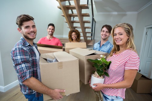 Professional movers loading furniture during Sevenkings house removals