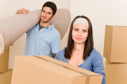 Professional movers handling furniture during a flat removal in Sevenkings